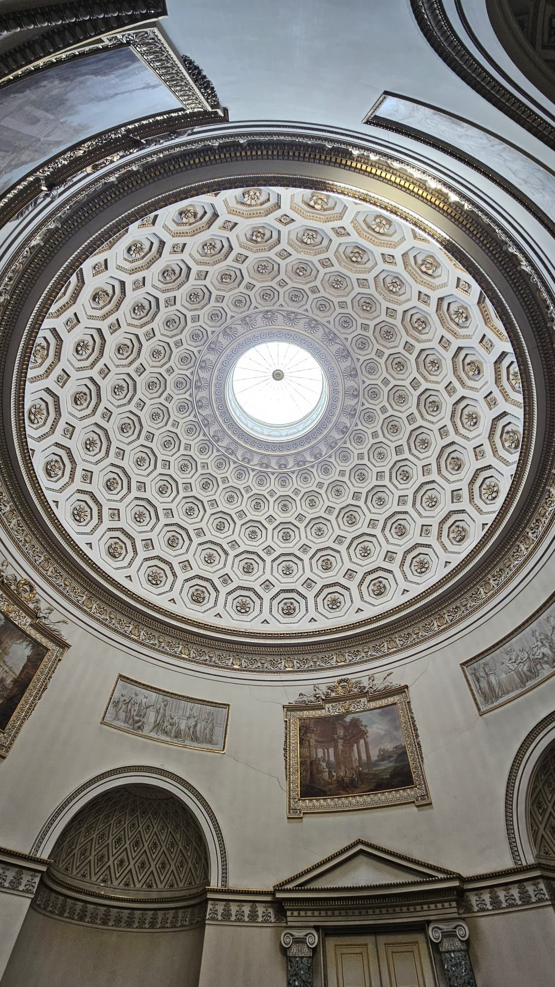 The Saloon rises over 62 feet to a coffered dome modelled on the Pantheon in Rome