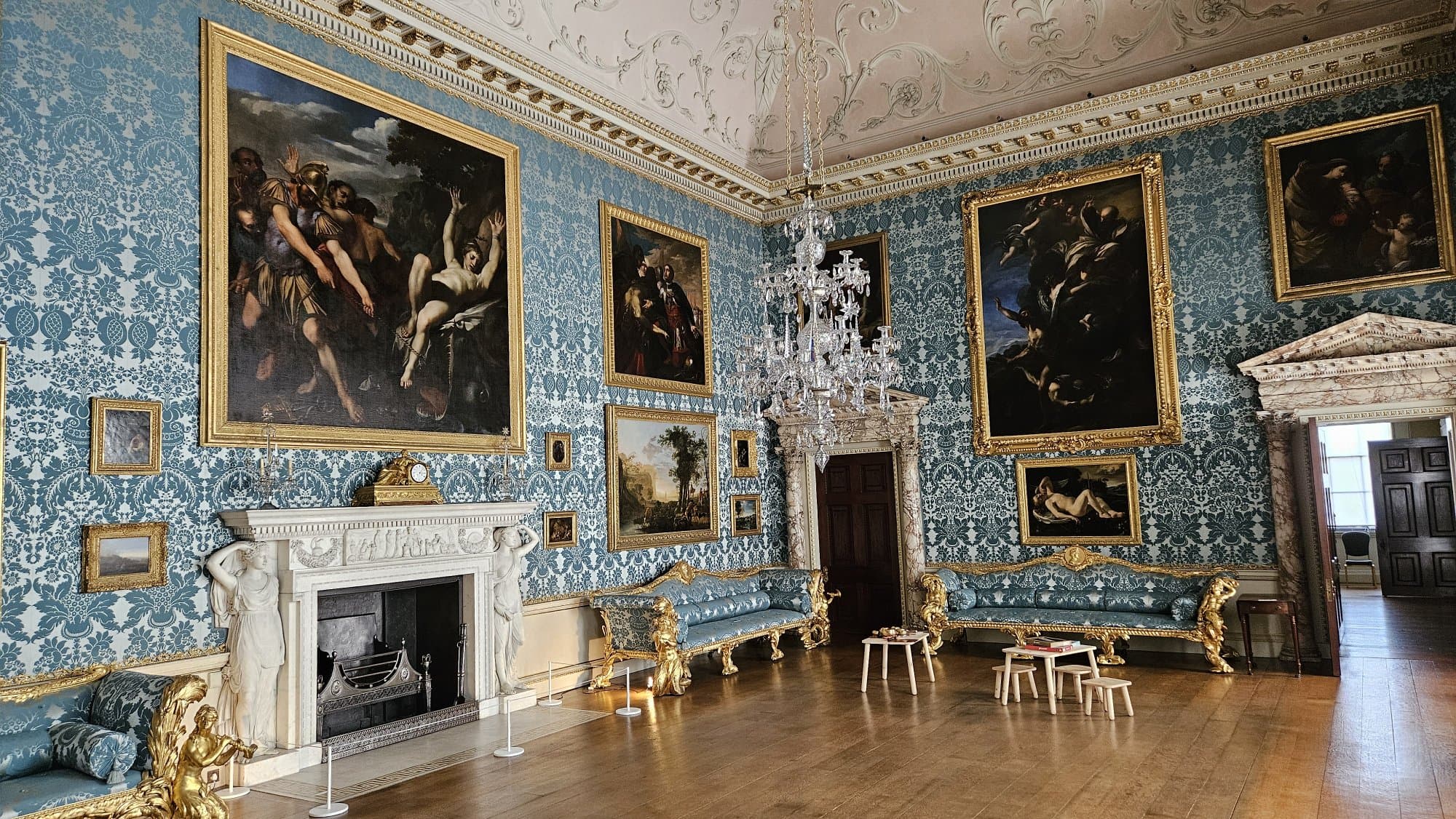 The drawing room with it's powder-blue wool-and-silk damask in an old-fashioned "pomegranate" pattern.