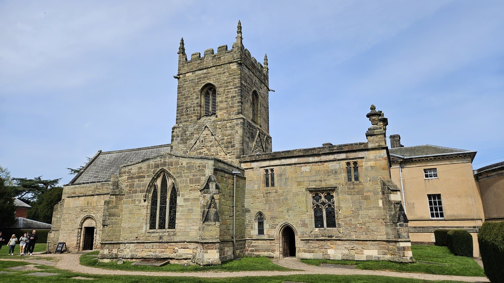 The church is laid out on an unusually ambitious cruciform plan with a central tower over the crossing.