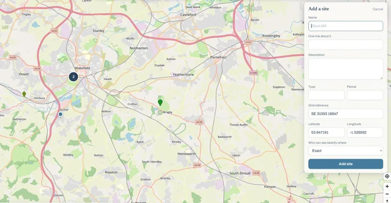 A pin dropped on the map, with a side panel whose grid reference and coordinates are already filled in